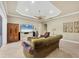 Spacious living area features a large TV and comfortable seating at 7041 Beechmont Ter, Lakewood Ranch, FL 34202