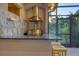 Outdoor kitchen with stainless steel appliances and granite countertops at 7041 Beechmont Ter, Lakewood Ranch, FL 34202