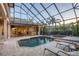 Enjoy this relaxing pool and spa with outdoor kitchen at 7041 Beechmont Ter, Lakewood Ranch, FL 34202