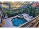An elevated view of a luxurious pool and spa area at 7041 Beechmont Ter, Lakewood Ranch, FL 34202