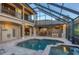 Enclosed pool area with kitchen and dining spaces at 7041 Beechmont Ter, Lakewood Ranch, FL 34202