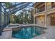 Lush landscaping surrounds this relaxing pool and spa at 7041 Beechmont Ter, Lakewood Ranch, FL 34202