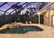 Relaxing covered pool and spa with plenty of seating at 7041 Beechmont Ter, Lakewood Ranch, FL 34202