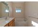 Bathroom with a bathtub, shower, and updated vanity at 7156 Rue De Palisades # 3, Sarasota, FL 34238