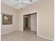Spacious bedroom with ceiling fan and access to the hallway at 7156 Rue De Palisades # 3, Sarasota, FL 34238