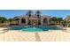 Resort-style community pool with surrounding patio area at 7156 Rue De Palisades # 3, Sarasota, FL 34238