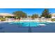 Inviting community pool with ample deck space and lounge chairs at 7156 Rue De Palisades # 3, Sarasota, FL 34238