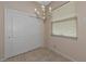 Dining area with chandelier and sliding door to closet at 7156 Rue De Palisades # 3, Sarasota, FL 34238