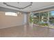 Dining room with lake view and tiled floor at 7156 Rue De Palisades # 3, Sarasota, FL 34238
