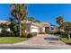 Well-maintained house with attractive landscaping and a paver driveway at 7156 Rue De Palisades # 3, Sarasota, FL 34238