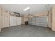 Two-car garage with storage cabinets and overhead door at 7156 Rue De Palisades # 3, Sarasota, FL 34238