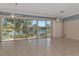 Bright Gathering room with sliding glass doors and lake view at 7156 Rue De Palisades # 3, Sarasota, FL 34238