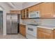 Kitchen boasts stainless steel appliances and light wood cabinets at 7156 Rue De Palisades # 3, Sarasota, FL 34238