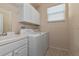 Laundry room with washer, dryer, and utility sink at 7156 Rue De Palisades # 3, Sarasota, FL 34238