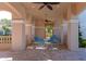 Covered patio area with table and chairs near pool at 7156 Rue De Palisades # 3, Sarasota, FL 34238