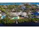 Expansive backyard with pool, dock, and lush greenery at 7618 Midnight Pass Rd, Sarasota, FL 34242