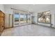 Open dining area with sliding glass doors to the backyard undergoing renovations at 7618 Midnight Pass Rd, Sarasota, FL 34242