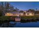 Private dock on a calm waterway by a home with lush landscaping at 7618 Midnight Pass Rd, Sarasota, FL 34242