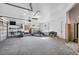 Spacious garage with storage shelves, kayaks, and bikes at 7618 Midnight Pass Rd, Sarasota, FL 34242