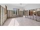 Bright kitchen area under renovation with tiled floors and large windows at 7618 Midnight Pass Rd, Sarasota, FL 34242