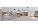 Open and spacious living room under renovation with tile floors and large windows at 7618 Midnight Pass Rd, Sarasota, FL 34242