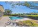 Tranquil pool area with lush landscaping and a paved patio at 7618 Midnight Pass Rd, Sarasota, FL 34242