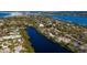 Beautiful canal-front neighborhood with lush trees at 7618 Midnight Pass Rd, Sarasota, FL 34242