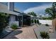 Backyard featuring mature landscaping and a screened enclosure at 7806 Ontario Street Cir # 7806, Sarasota, FL 34243