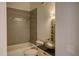 Bathroom with decorative tile accent, a sleek sink bowl, and neutral colors at 7806 Ontario Street Cir # 7806, Sarasota, FL 34243