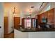 Inviting kitchen boasts granite countertops, breakfast bar, and modern stainless steel appliances at 7806 Ontario Street Cir # 7806, Sarasota, FL 34243
