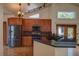Well-appointed kitchen features granite counters, sleek stainless appliances, and mosaic backsplash at 7806 Ontario Street Cir # 7806, Sarasota, FL 34243