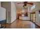 Open living room showcases tile floors, high ceilings and flows into the adjacent kitchen with breakfast bar at 7806 Ontario Street Cir # 7806, Sarasota, FL 34243