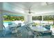 Community pavilion offering seating, overlooking the pool and tennis courts at 7806 Ontario Street Cir # 7806, Sarasota, FL 34243