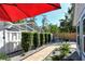 Landscaped backyard with brick pavers, gravel, and decorative accents at 7806 Ontario Street Cir # 7806, Sarasota, FL 34243