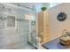 Bathroom with glass shower and updated vanity at 7806 Ontario Street Cir # 7806, Sarasota, FL 34243