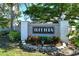 Treetops community entrance sign with brick pillars and landscaping at 7806 Ontario Street Cir # 7806, Sarasota, FL 34243