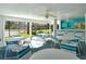 Community pool area with tables and chairs for lounging at 7806 Ontario Street Cir # 7806, Sarasota, FL 34243