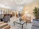 Spacious lobby with multiple seating areas and a chandelier at 800 N Tamiami Trl # 201, Sarasota, FL 34236