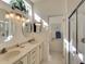 Bathroom with double vanity and large mirrors at 8317 Idlewood Ct, Lakewood Ranch, FL 34202