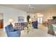 Spacious living room with comfortable seating and a view into dining area at 8317 Idlewood Ct, Lakewood Ranch, FL 34202