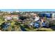 Aerial view of community with pool, tennis court, and nearby city skyline at 850 S Tamiami Trl # 402, Sarasota, FL 34236