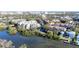 Aerial view of waterfront condo community near downtown, showcasing lush landscaping and waterways at 850 S Tamiami Trl # 402, Sarasota, FL 34236