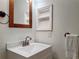 Small bathroom with updated vanity and shelving at 850 S Tamiami Trl # 402, Sarasota, FL 34236