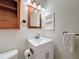 Updated bathroom with a vanity, shelving and toilet at 850 S Tamiami Trl # 402, Sarasota, FL 34236