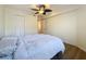Bright bedroom with a ceiling fan and built-in closet at 850 S Tamiami Trl # 402, Sarasota, FL 34236