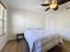 Bright bedroom with ceiling fan and wood-look flooring at 850 S Tamiami Trl # 402, Sarasota, FL 34236
