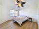 Spacious bedroom with ceiling fan and large window at 850 S Tamiami Trl # 402, Sarasota, FL 34236