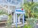 Building 4 entrance with stairway and tropical landscaping at 850 S Tamiami Trl # 402, Sarasota, FL 34236