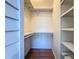 Walk-in closet with shelves and hanging rods at 850 S Tamiami Trl # 402, Sarasota, FL 34236