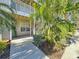 Ground level condo entrance with lush landscaping at 850 S Tamiami Trl # 402, Sarasota, FL 34236